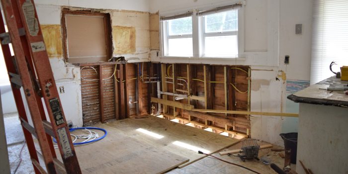 Residential reconstruction services are underway in a homeowner’s kitchen after experiencing water damage.