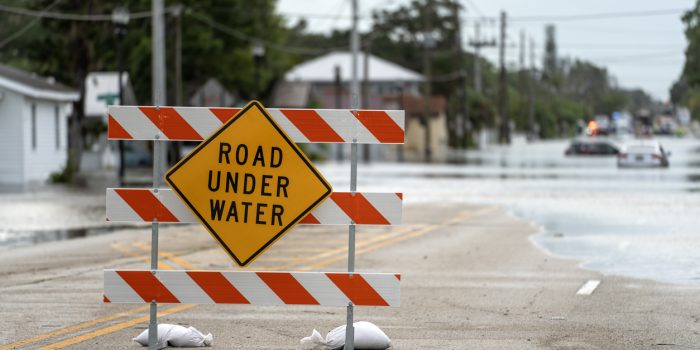 A road sign warns that the upcoming street is flooded as a result of a severe thunderstorm in the metro Atlanta area.