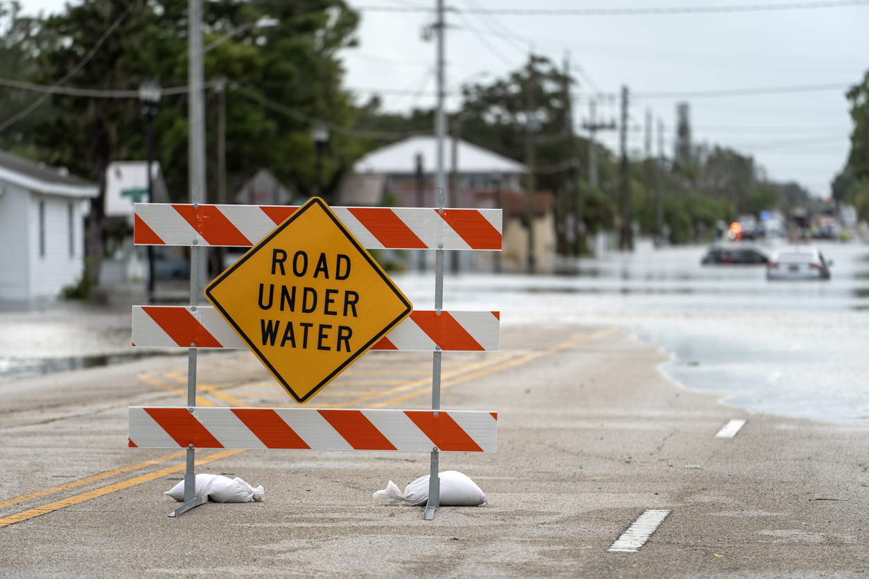 A road sign warns that the upcoming street is flooded as a result of a severe thunderstorm in the metro Atlanta area.